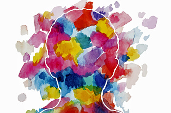 Umriss eines menschlichen Kopfs, der mit bunten Farbpunkten ausgemalt ist